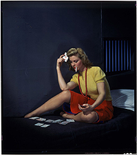 Nickolas Muray  Woman in cell, playing solitaire  ca. 1950  chromogenic transparency  22.9 x 19.4 cm  George Eastman House Collection